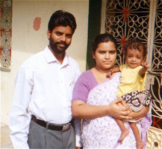 Pastor K. N. Silvi Siloam with wife, Phebe, and 18-month-old baby Mercy
